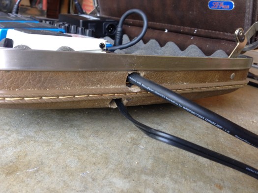 Redemption! The second hole proved to be in a perfect place for the AC adapter cord.