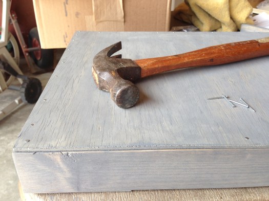 The plywood is too thin to screw in, so I used some small nails to secure it to the box frame.