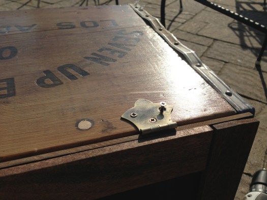 I attached the doors to the crates using some rustic-looking copper hinges. These crates are made from some thin wood, so be careful when drilling...