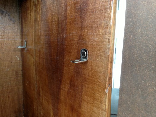 I found some extra shelf parts from our kitchen, and attached them to the side of the crate to hold a shelf.