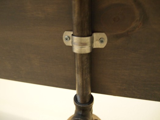 After the TV was anchored, I used these to secure the boards to the pipes. These added extra strength to the shelf, making it very sturdy.