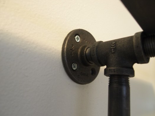 Use metal flanges to anchor the shelf to the wall.