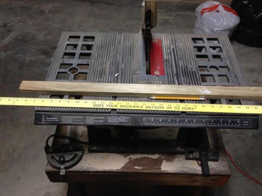 Measuring and cutting the wood on the table saw.