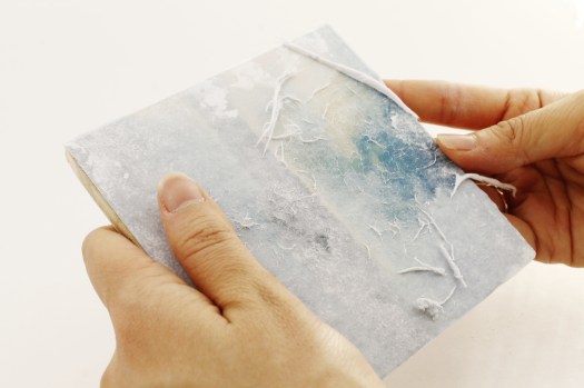 gently rub away the back of the paper.