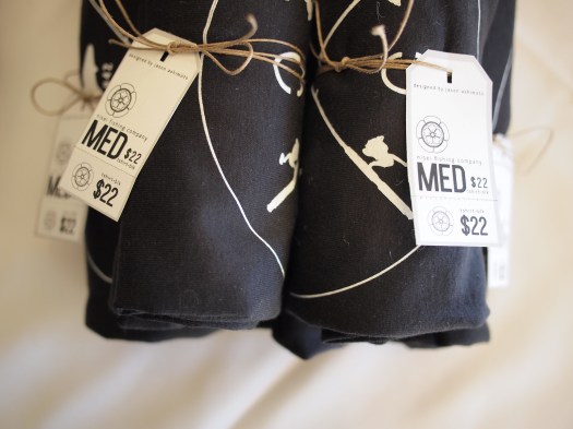 The packaged shirts. I used some hemp-colored thin twine, and rolled them so the chest graphic was displayed.