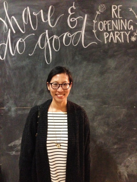 The wifey smiling in front of Share's giant chalkboard backdrop. 